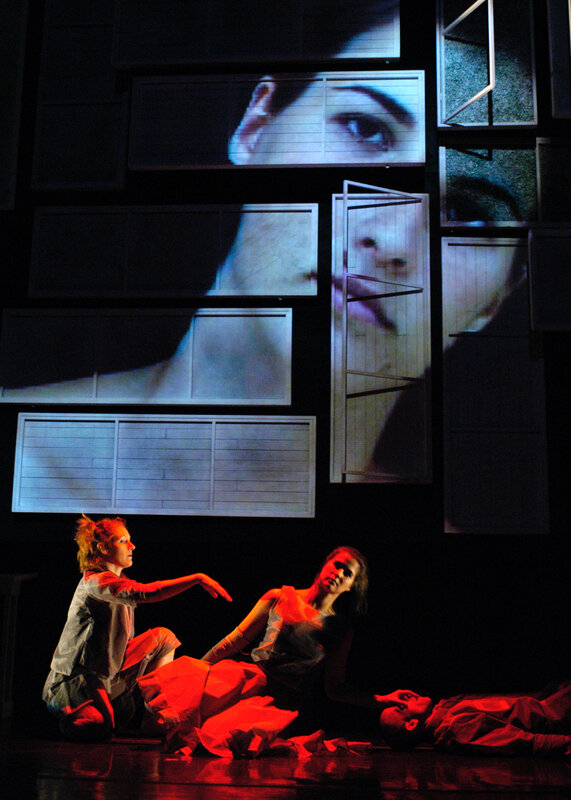 Dancers on stage with projections