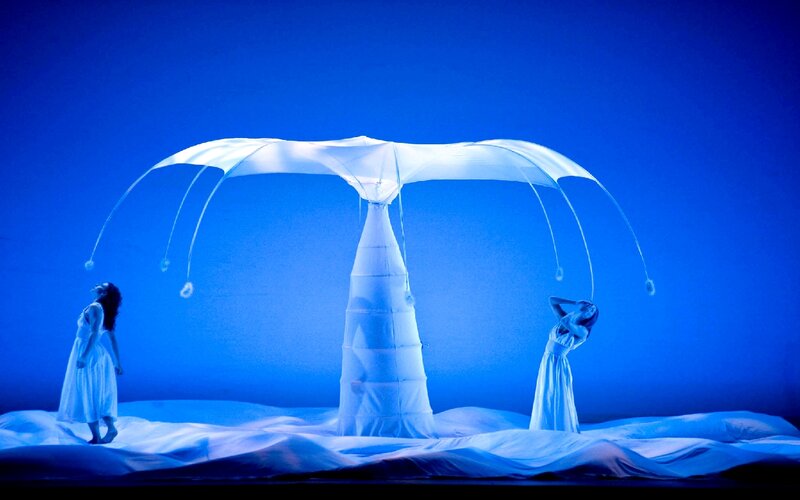 Dancers under a white canopy