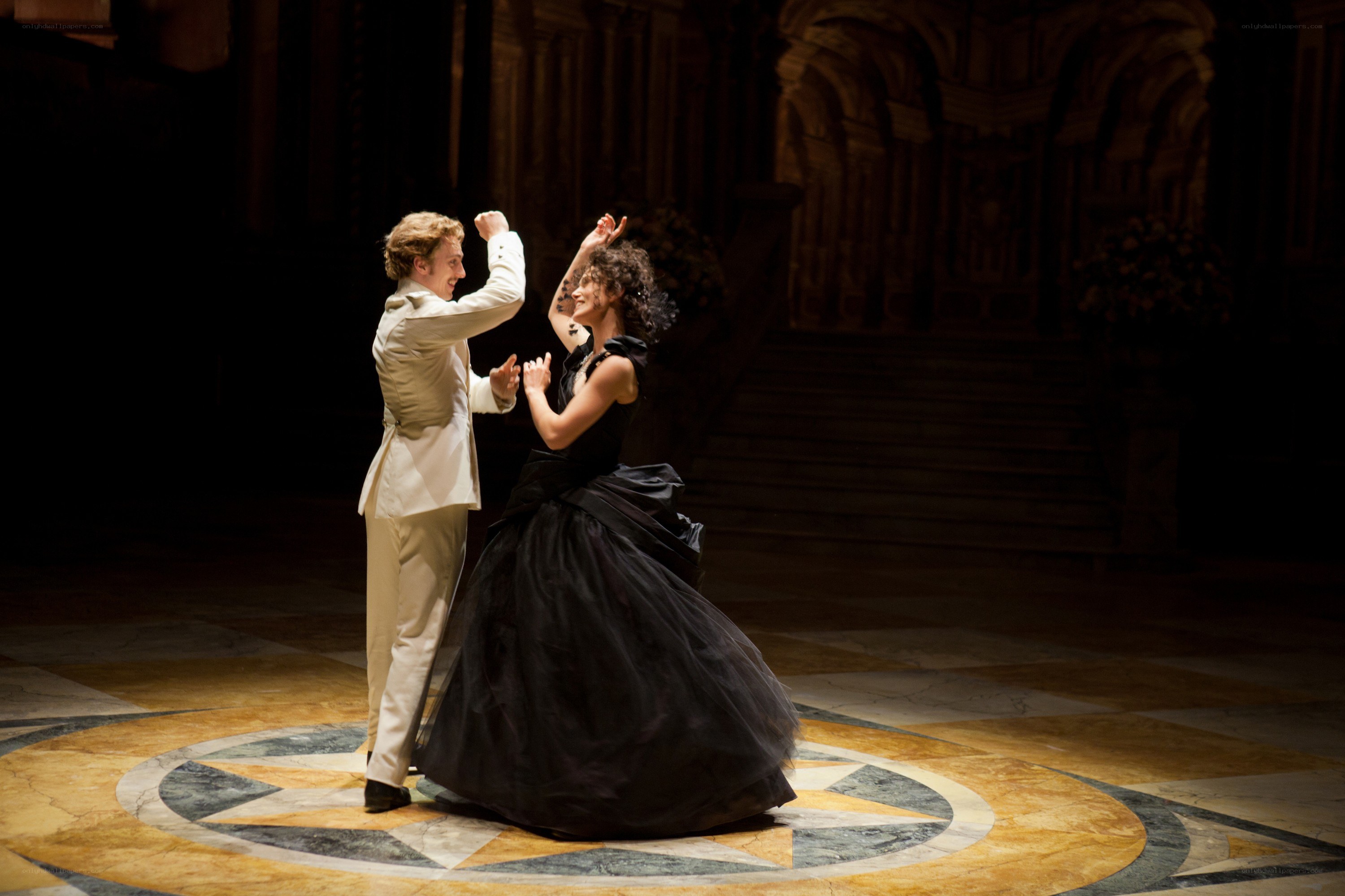 Dancing couple in a grand hall