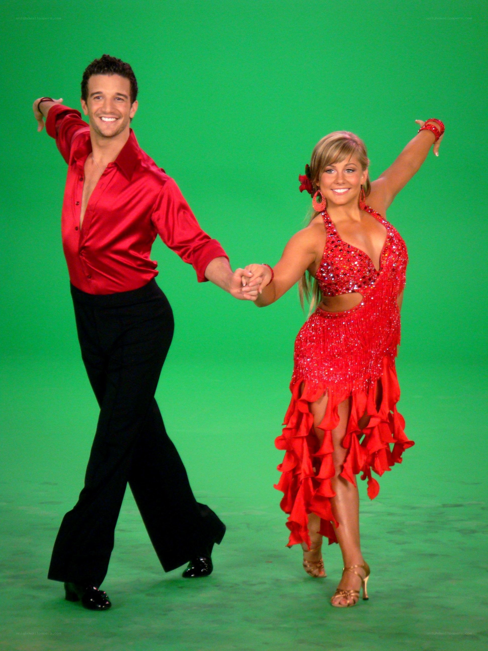 Dancing couple in red costumes
