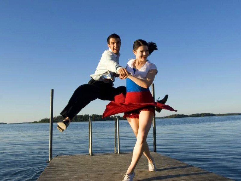Dancing couple on a dock