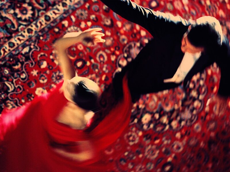 Dancing couple on a rug