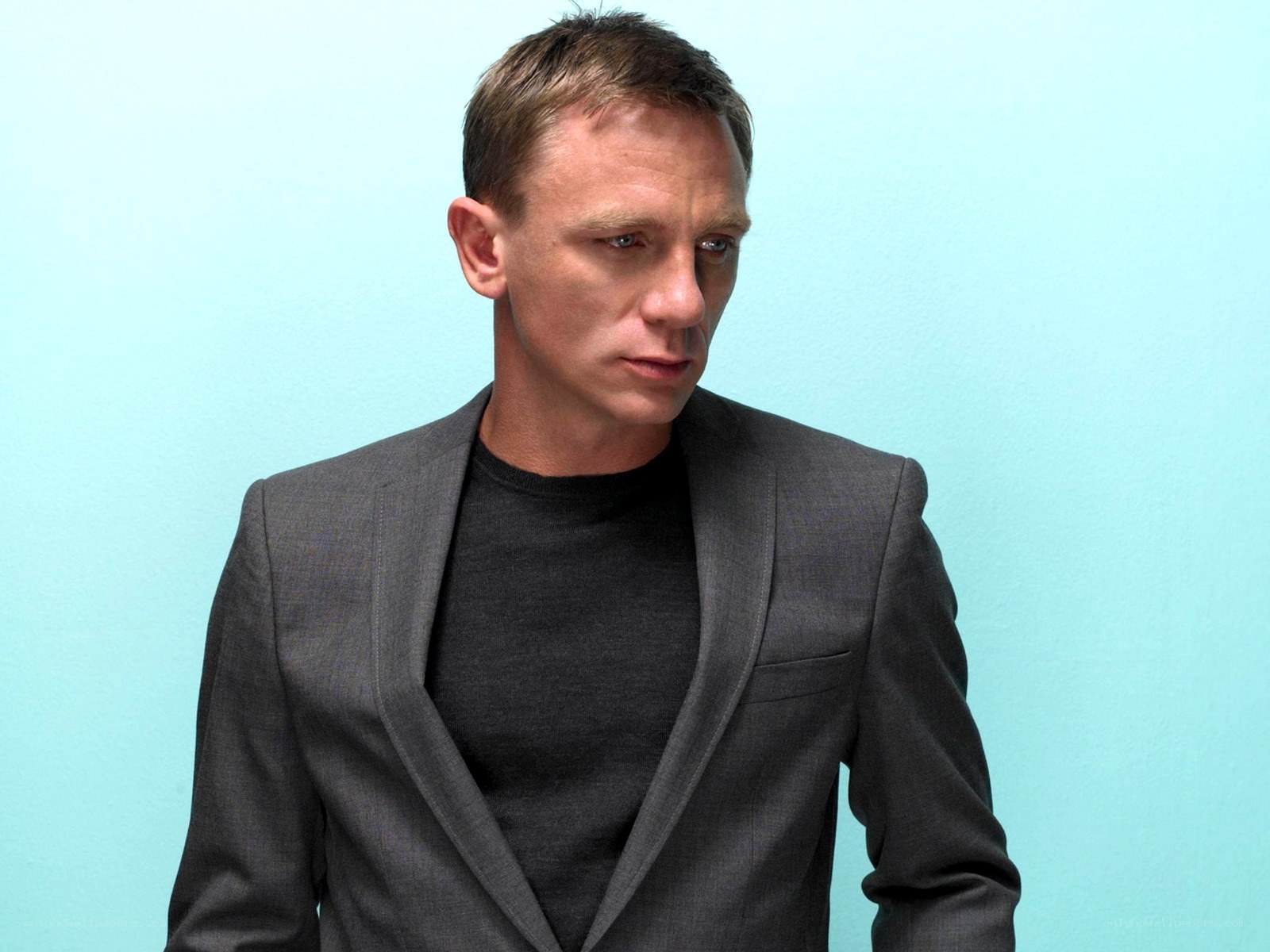 Daniel Craig in a gray suit
