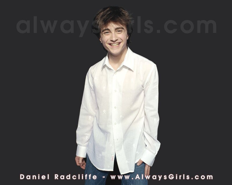 Daniel Radcliffe smiling in white shirt
