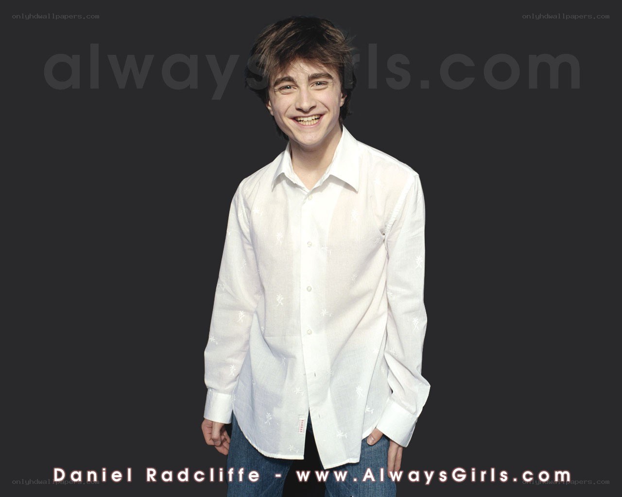 Daniel Radcliffe smiling in white shirt