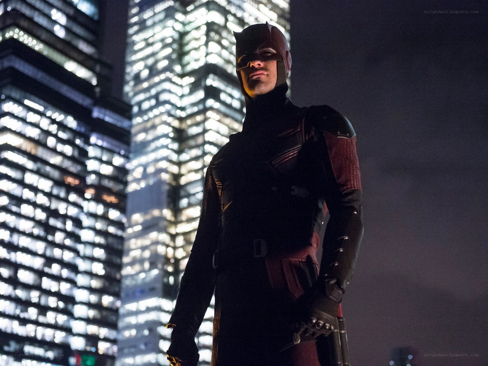 Daredevil stands on rooftop