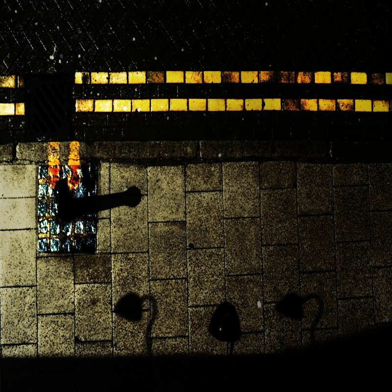 Dark alley with glowing tiles