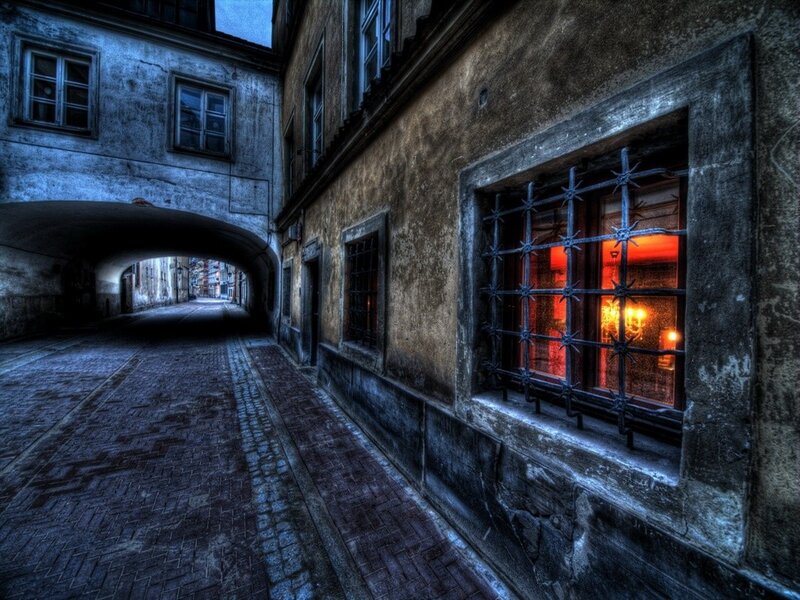 Dark alley with red-lit window