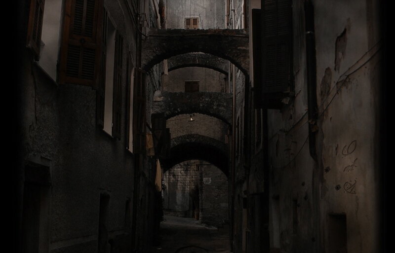 dark alley with stone arches