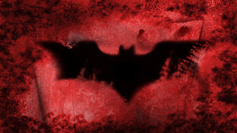 dark bat symbol on red wall