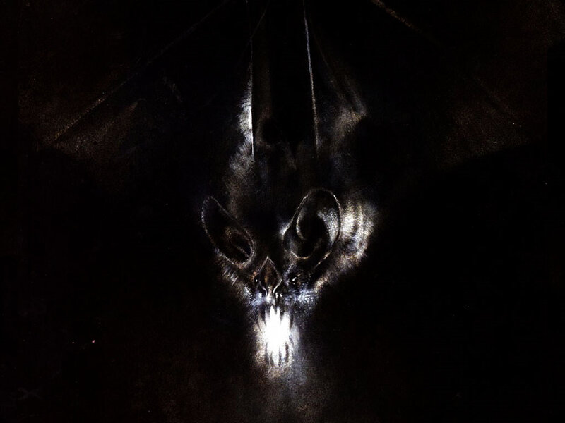 dark bat with glowing eyes