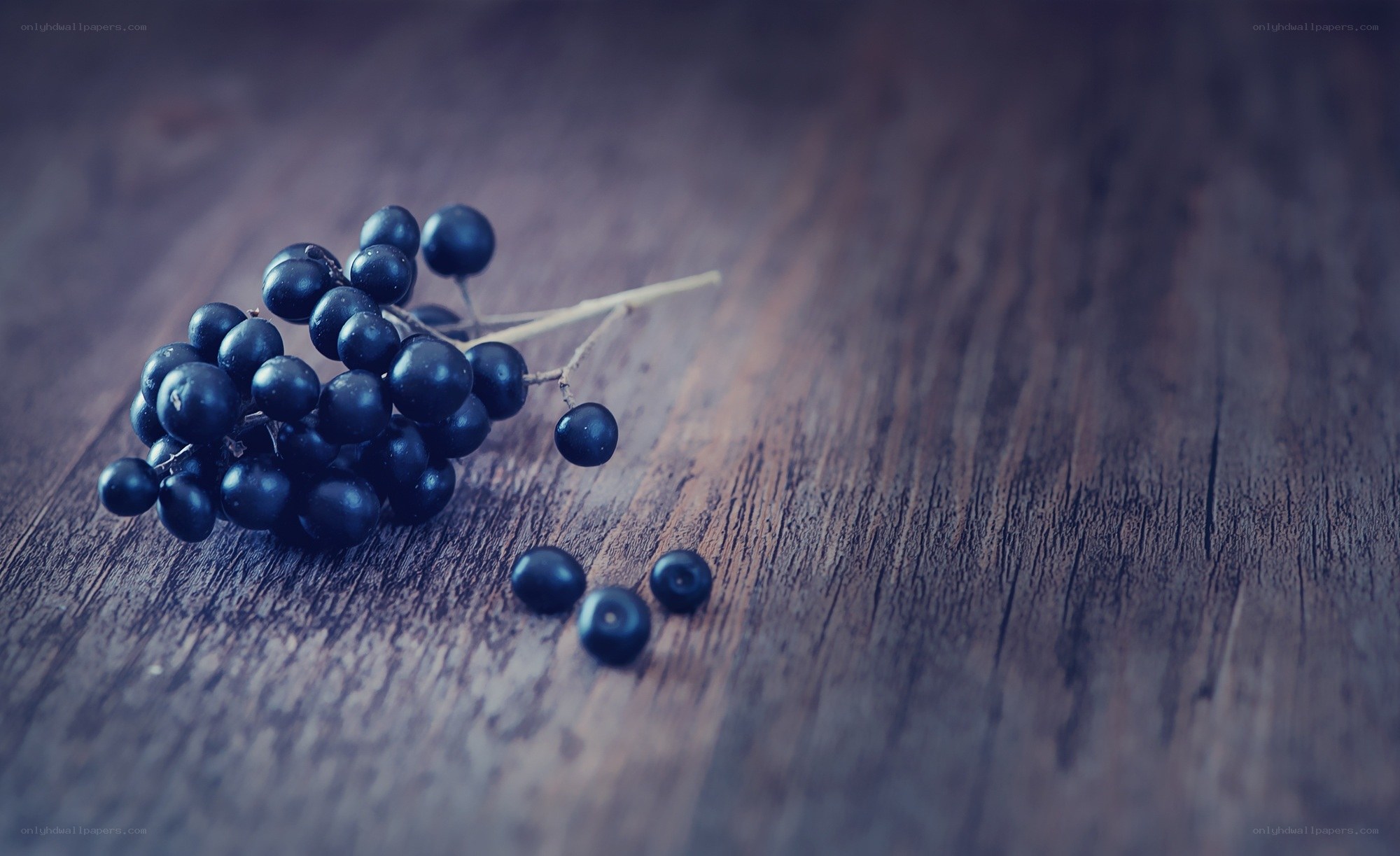 dark berries on wood