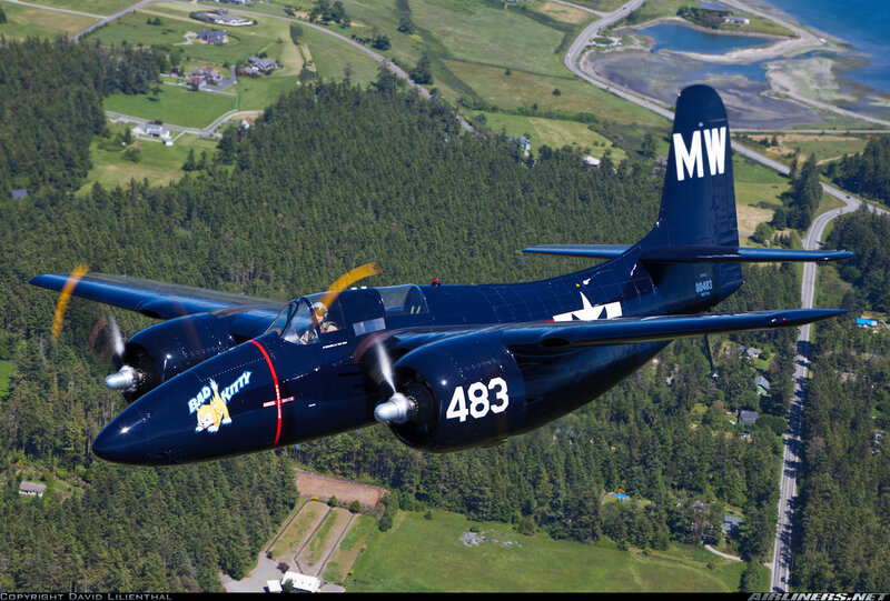 Dark Blue Airplane in Flight
