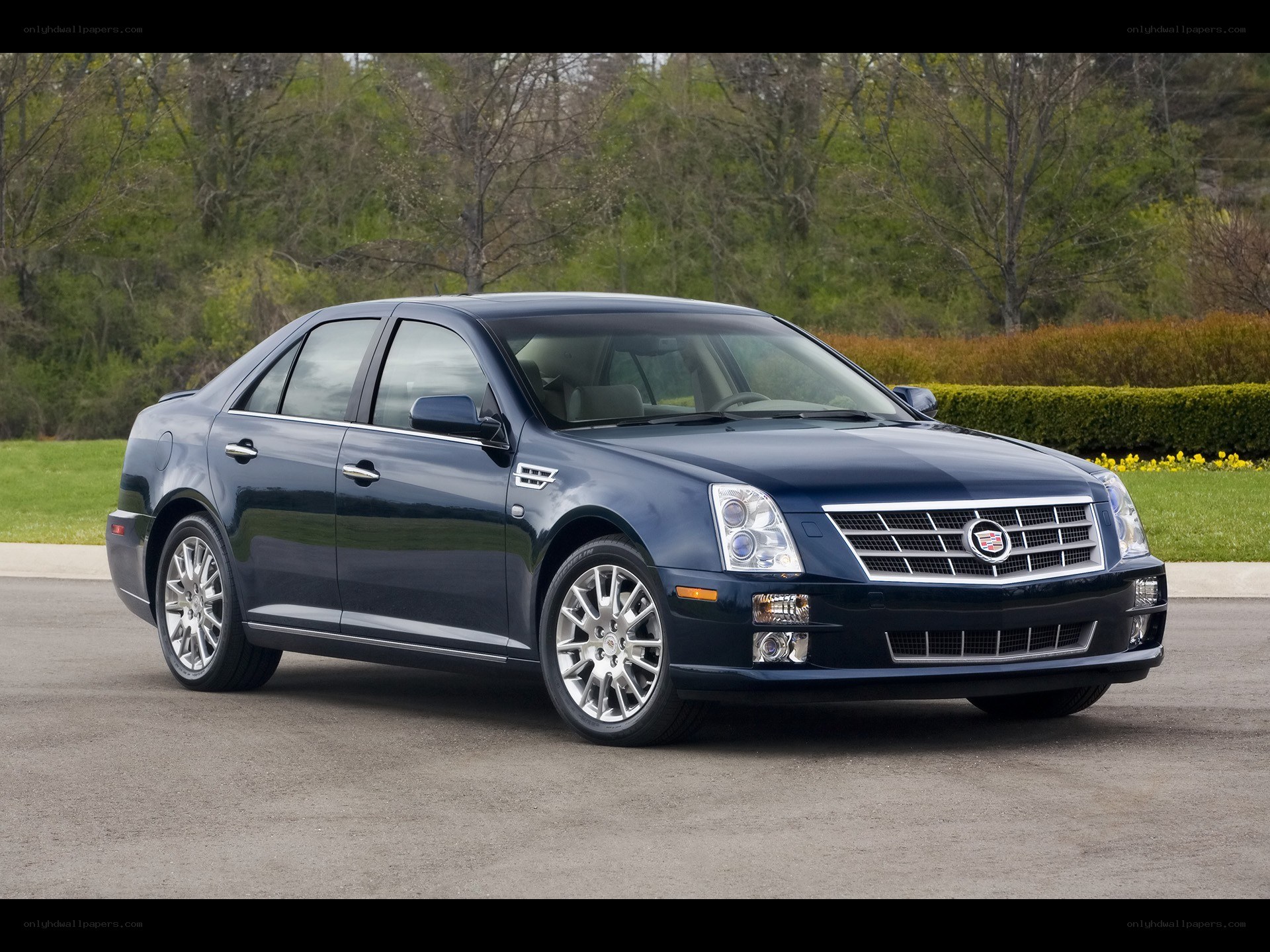 dark blue cadillac sedan