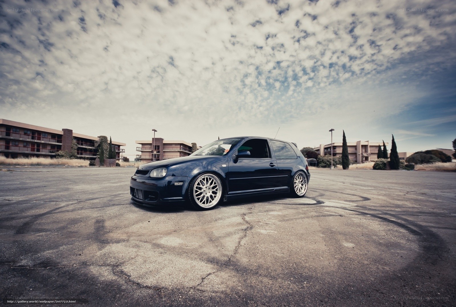 Dark blue car in empty lot