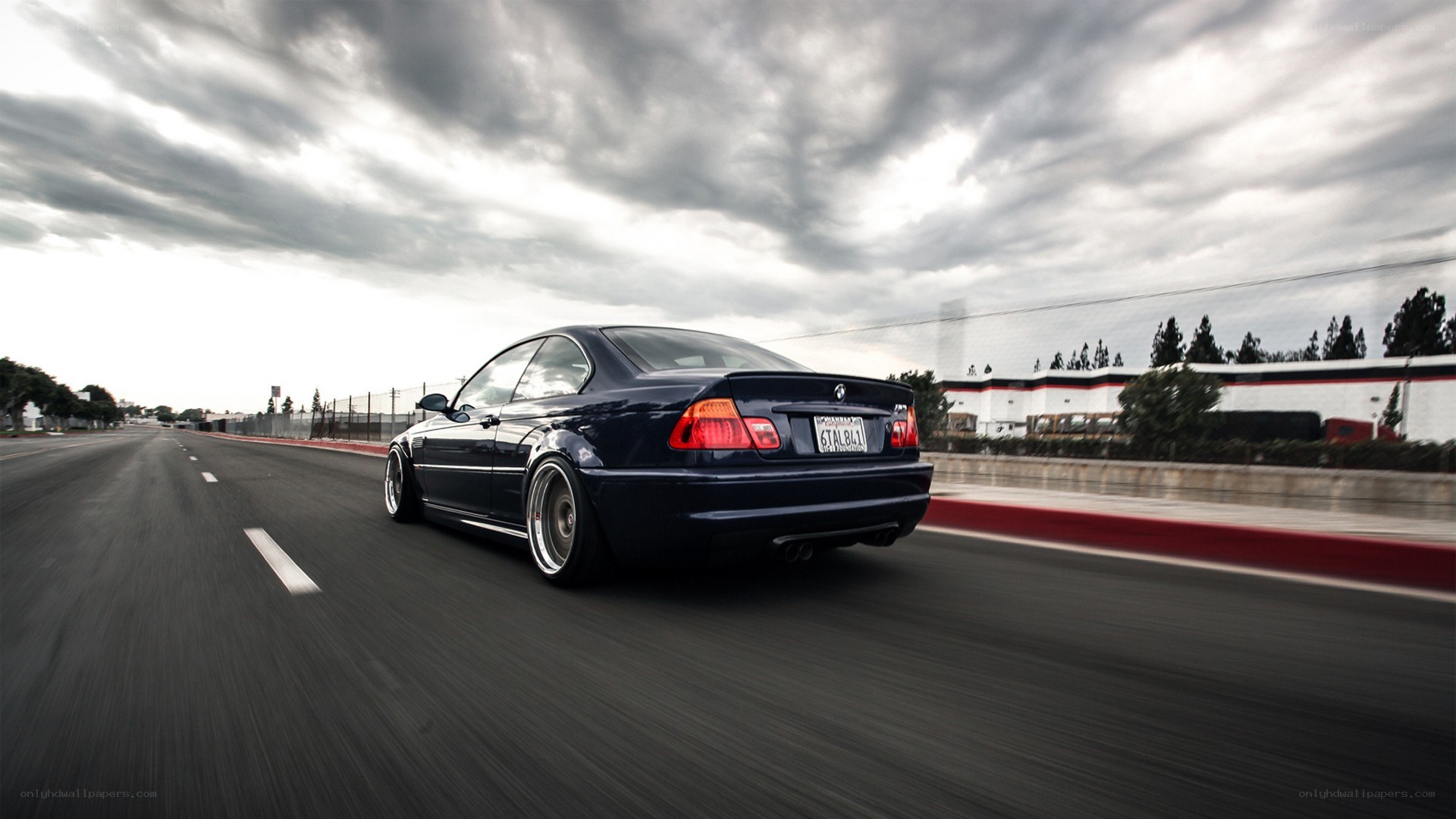 dark blue car on a road