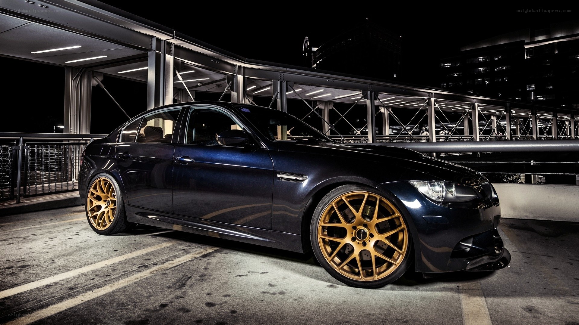 dark blue car with gold wheels
