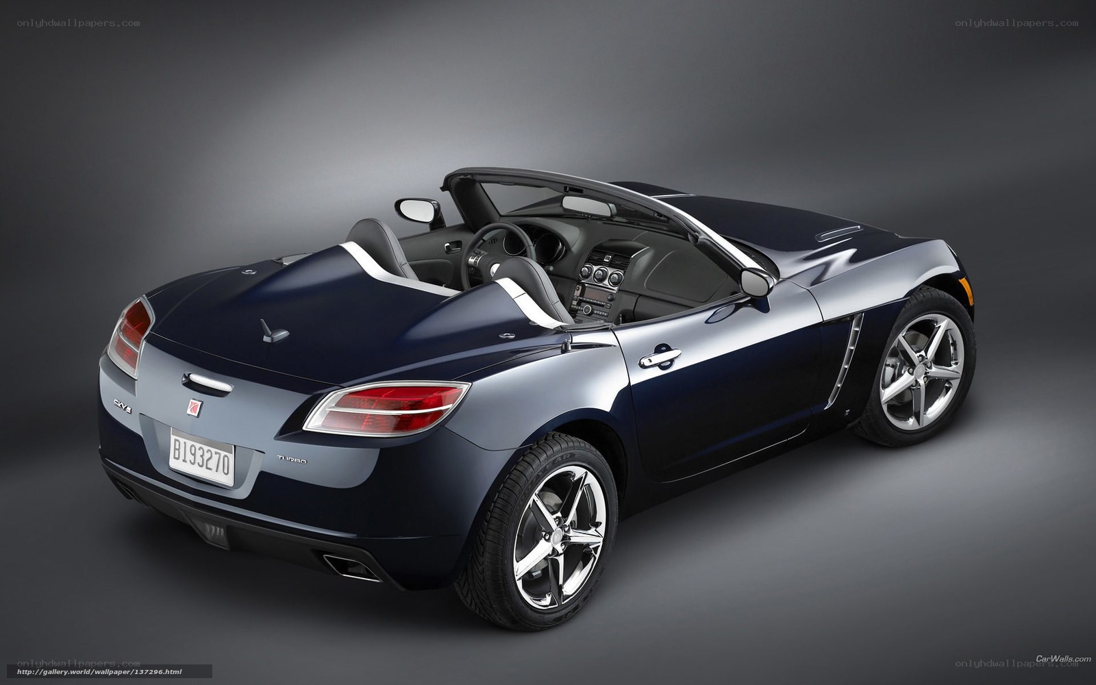 dark blue convertible sports car