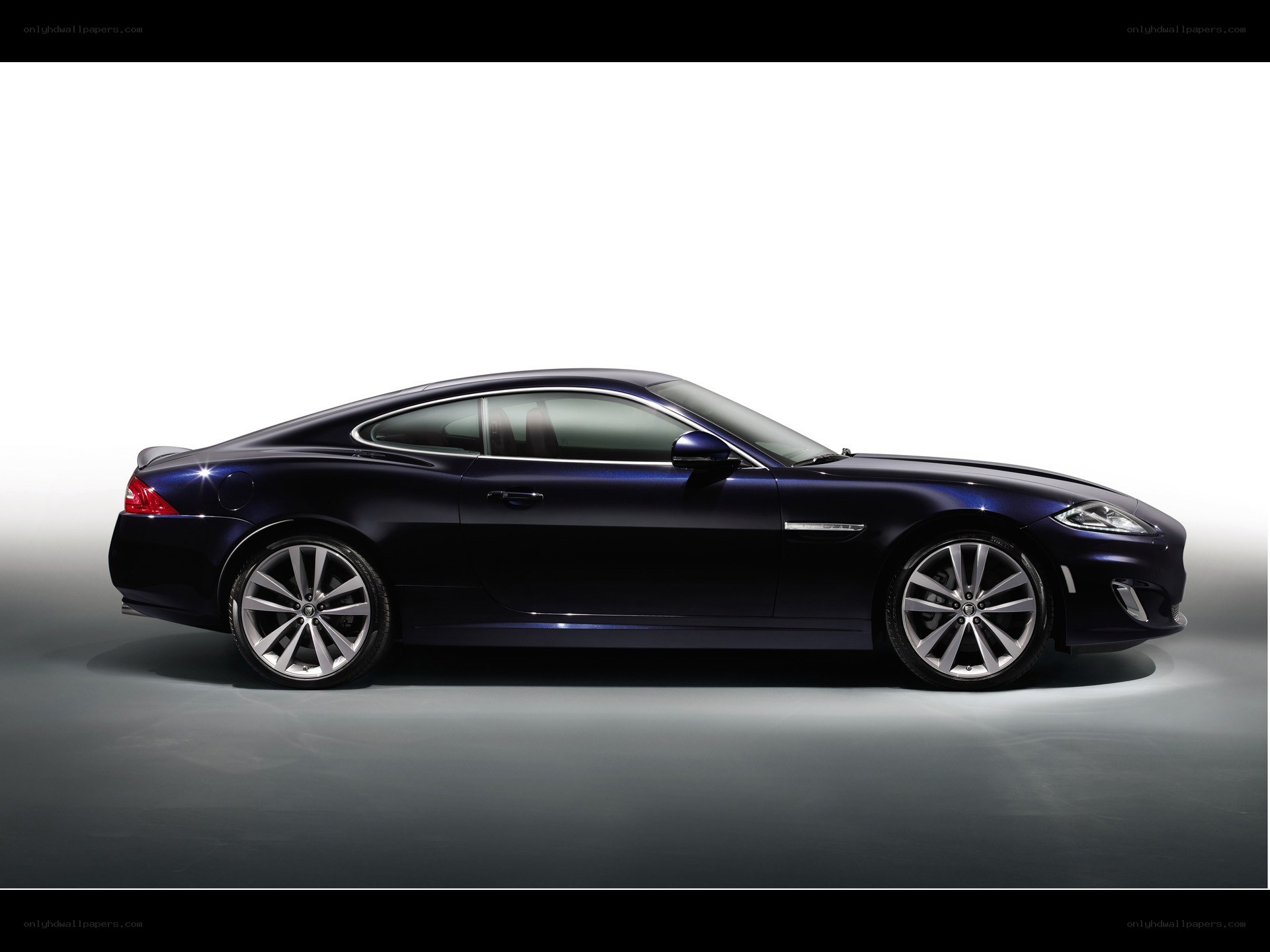 dark blue jaguar coupe