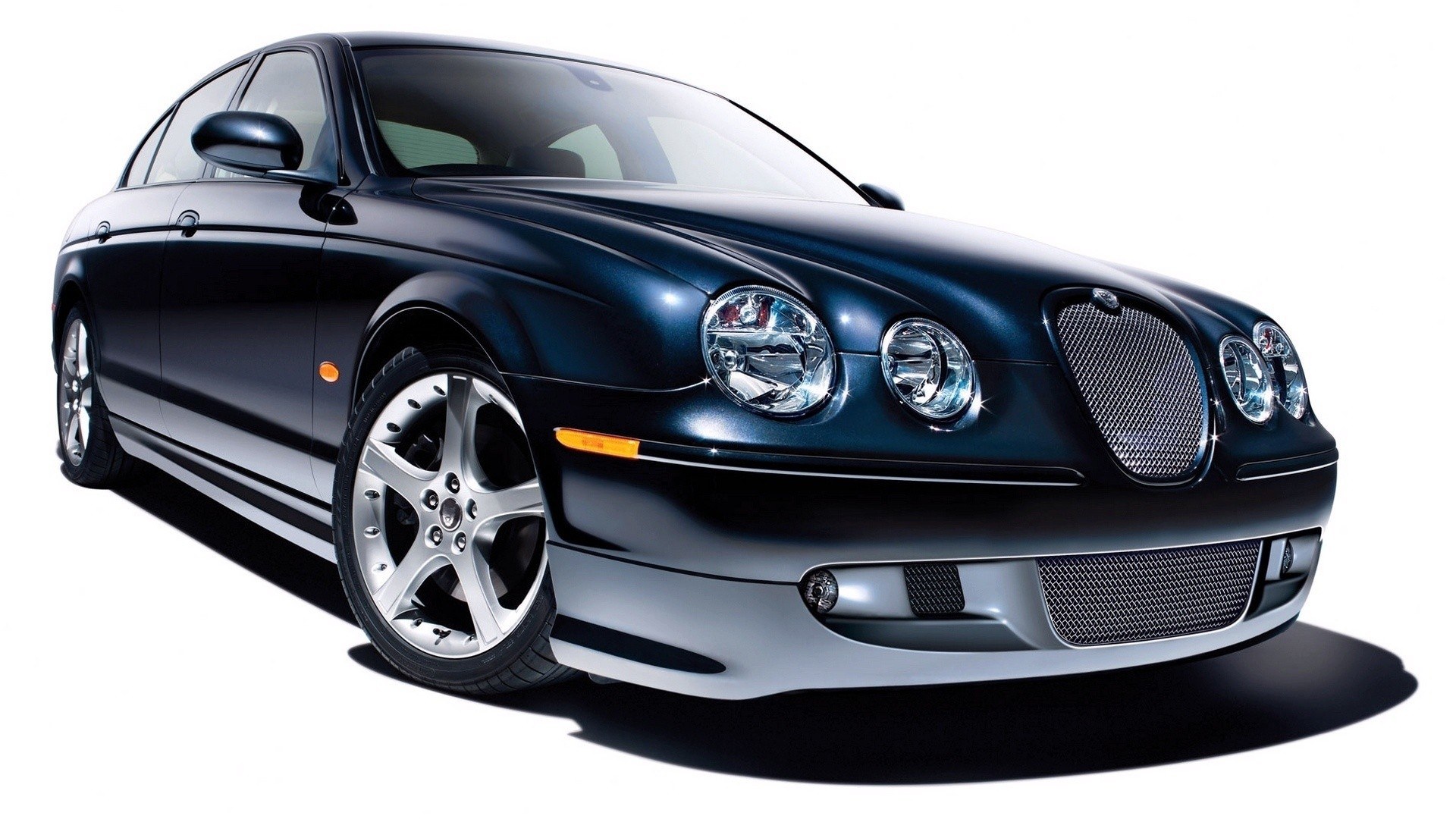 dark blue jaguar sedan