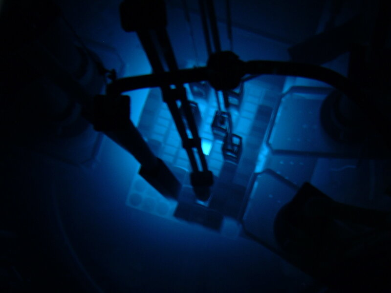 dark blue-lit mechanical structure