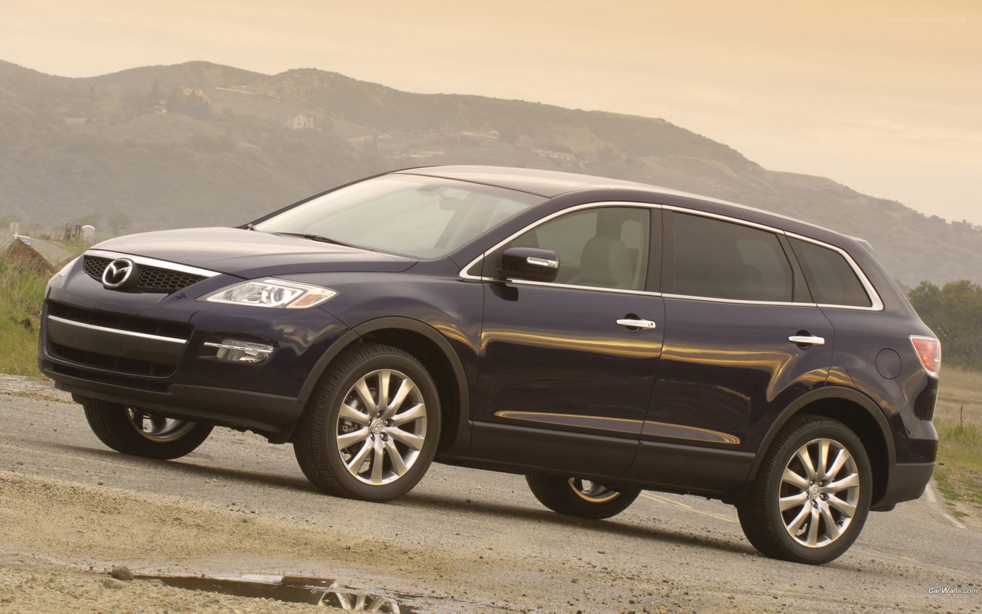 dark blue mazda cx-9 suv