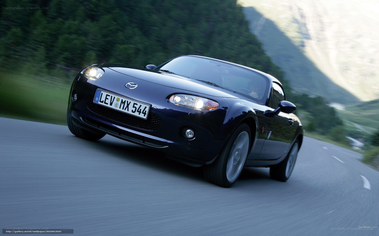 Dark blue Mazda MX-5 driving