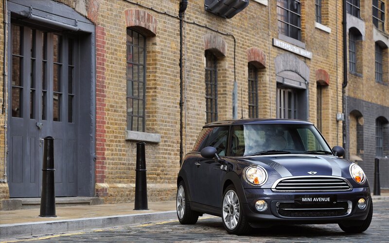 Dark blue MINI parked on cobblestone