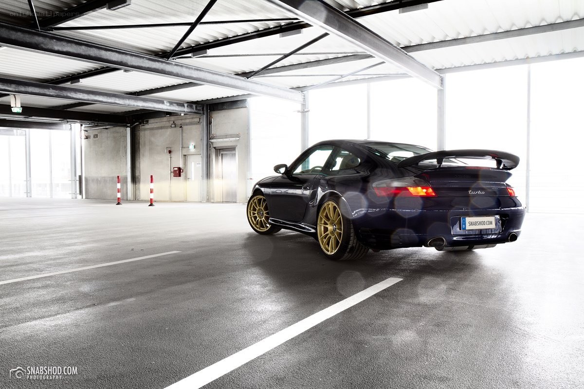 Dark blue Porsche in garage