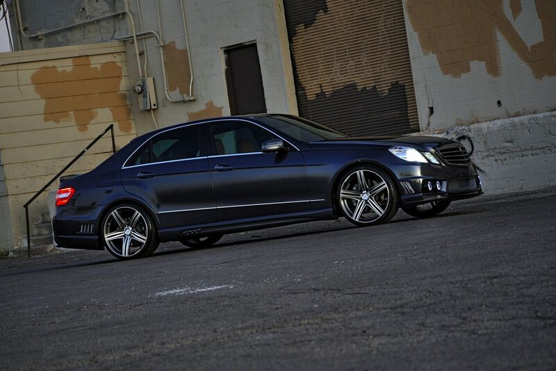dark blue sedan in alley