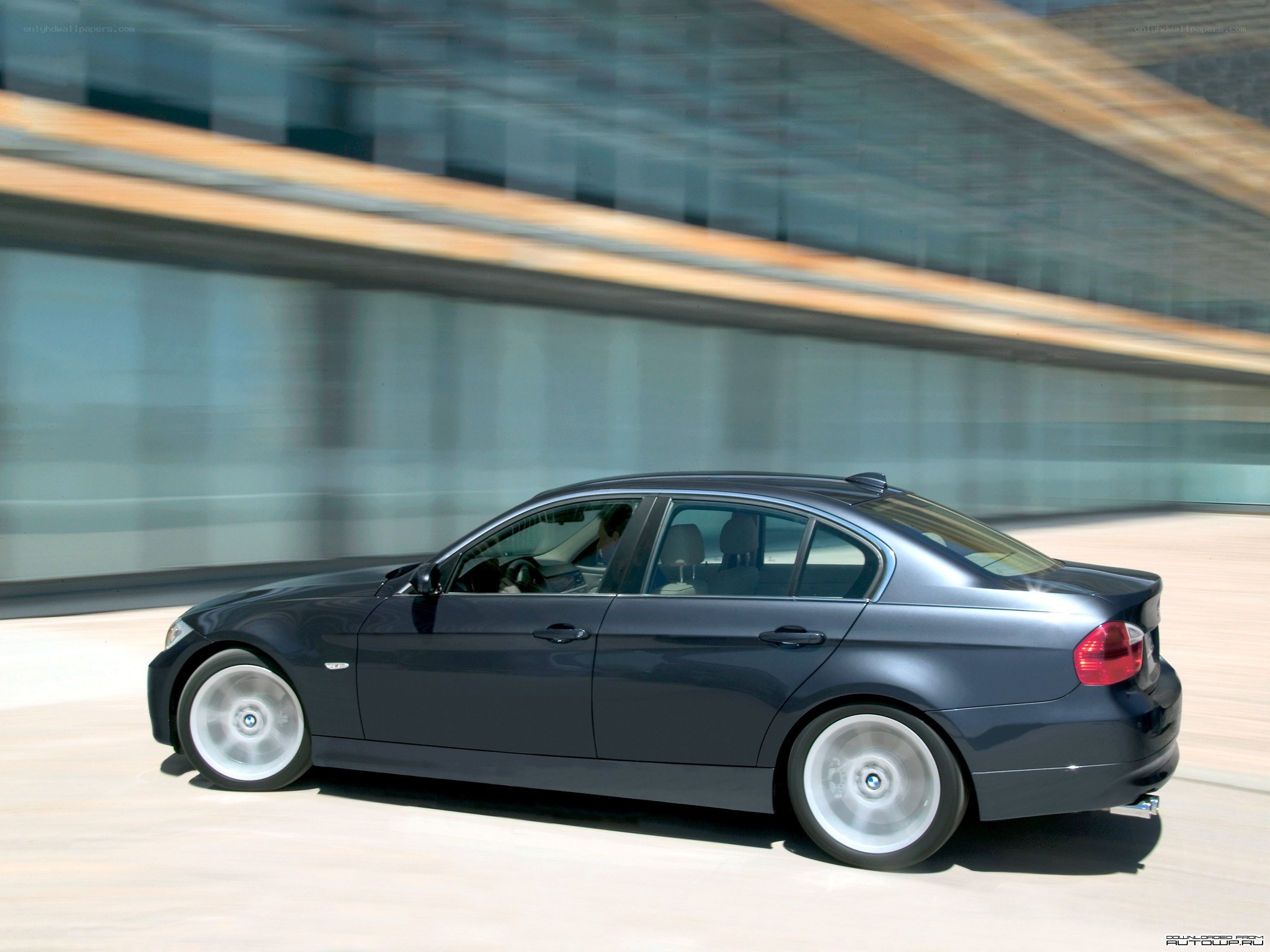 dark blue sedan in motion