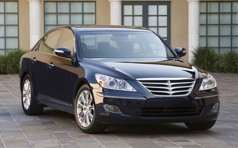 dark blue sedan parked outside