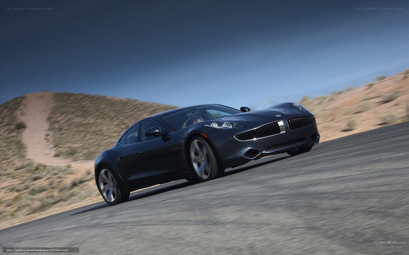 dark blue sports car on desert road