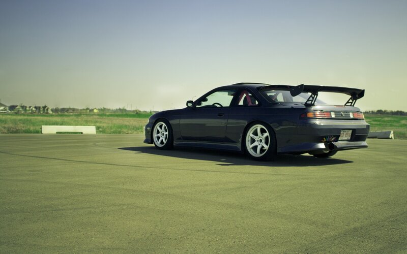 dark blue sports car on track
