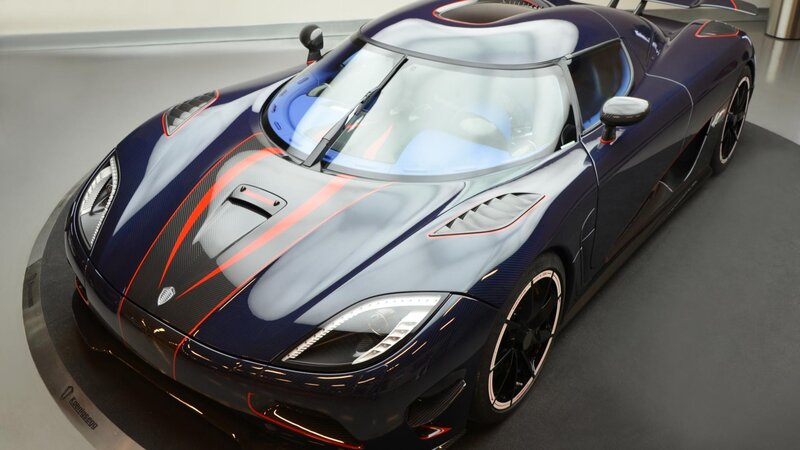 dark blue sports car with red stripes