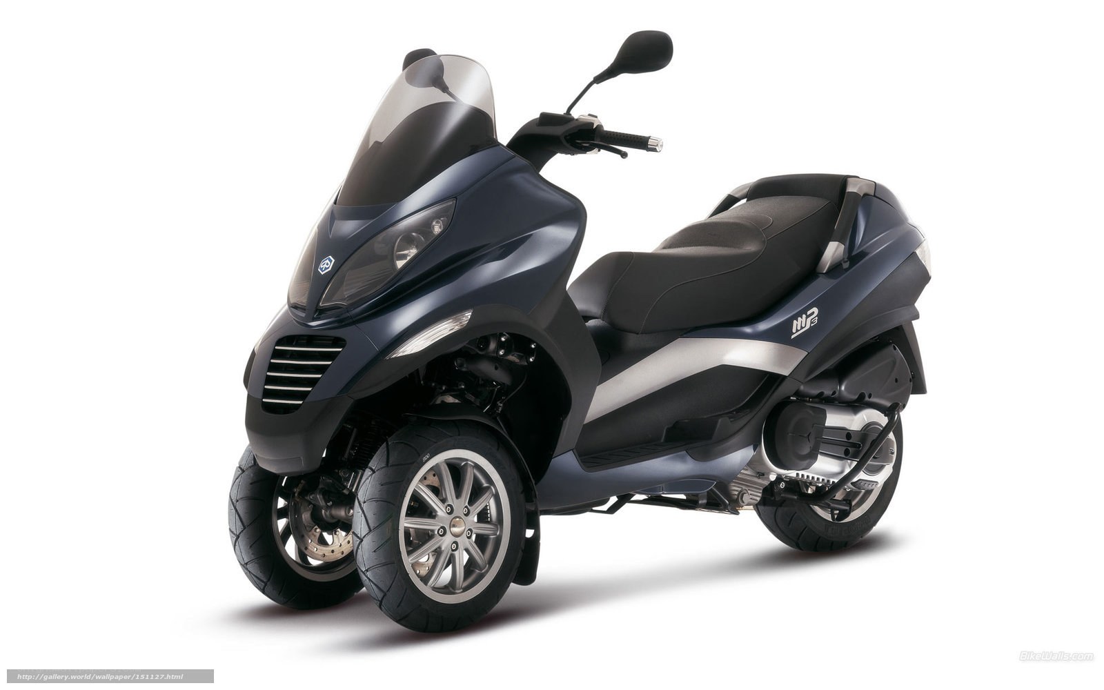dark blue three-wheeled scooter