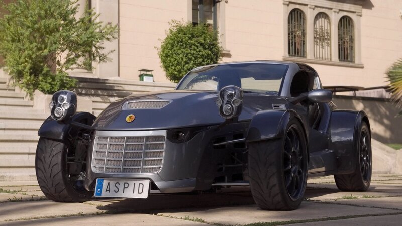 dark blue three-wheeled sports car