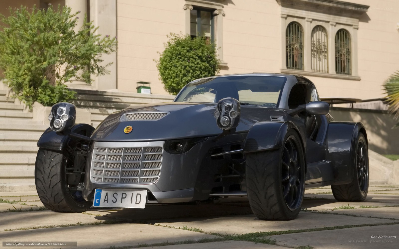 Dark blue three-wheeled sports car