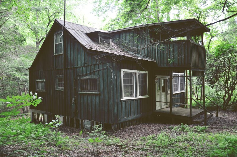 Dark Cabin in Forest
