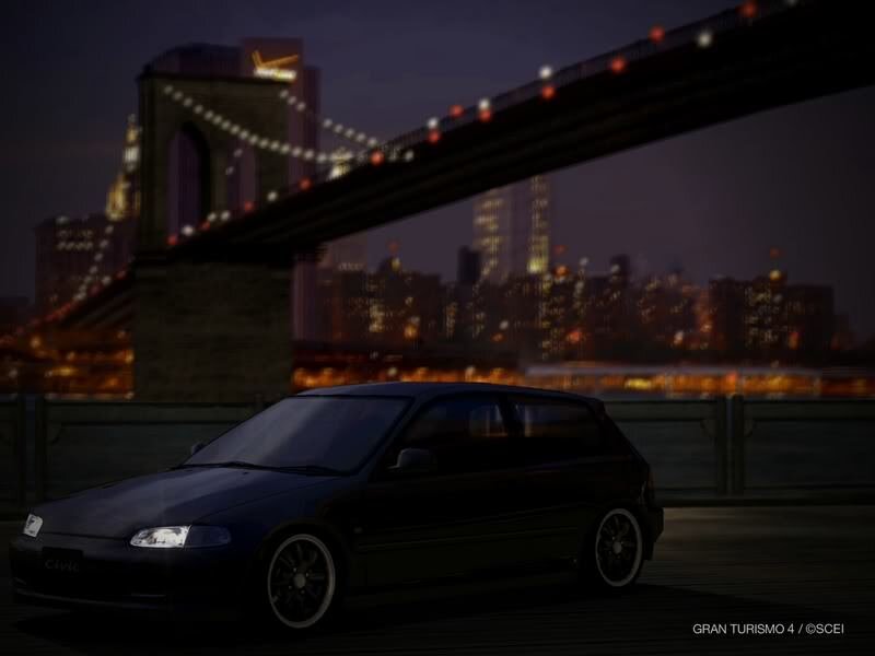 Dark car on bridge at night