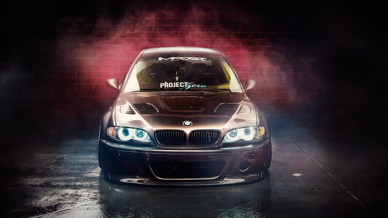 dark car with glowing headlights