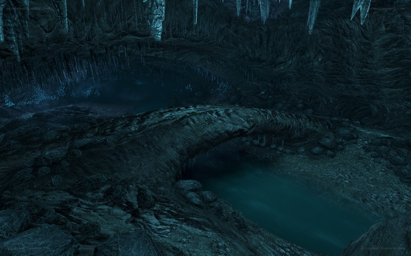 dark cave with glowing water
