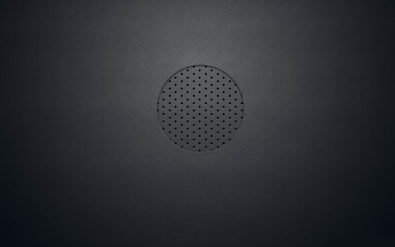 dark circular speaker grille