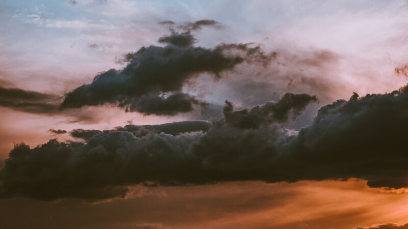 Dark Clouds at Sunset — Orange, Dramatic