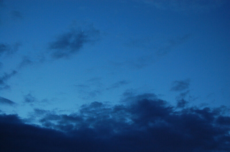 Dark Clouds in Blue Sky