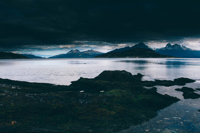 Dark clouds over a coastal landscape