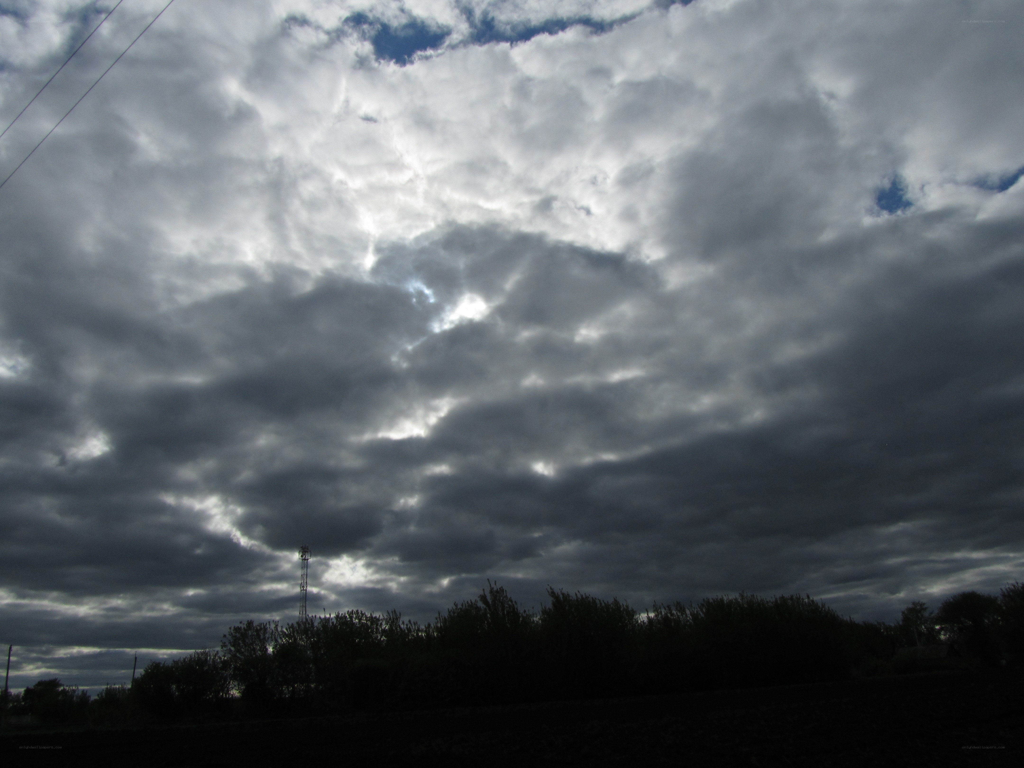 dark clouds over a field