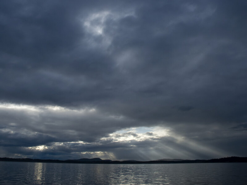 Dark clouds over a lake