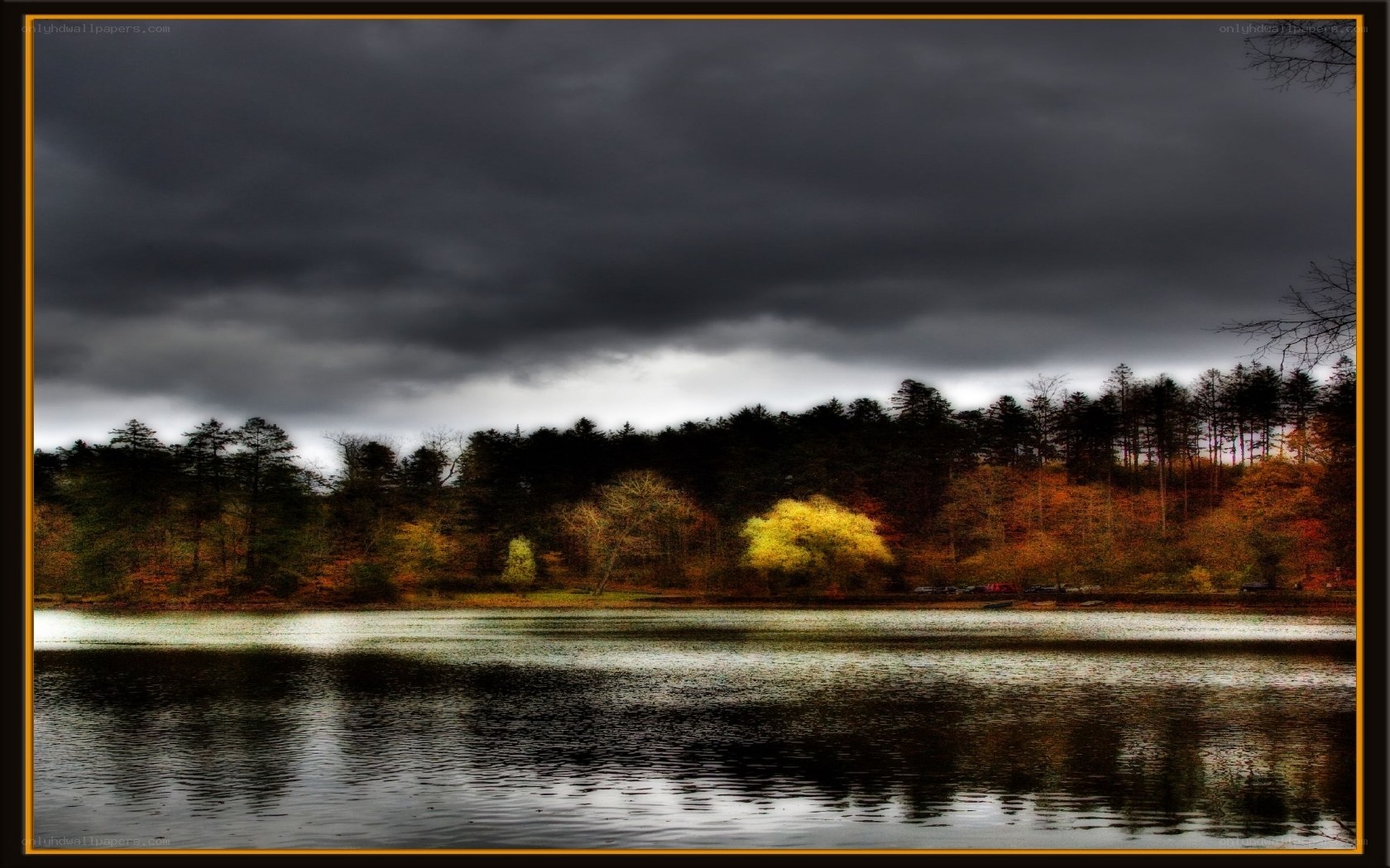 Dark clouds over autumn lake