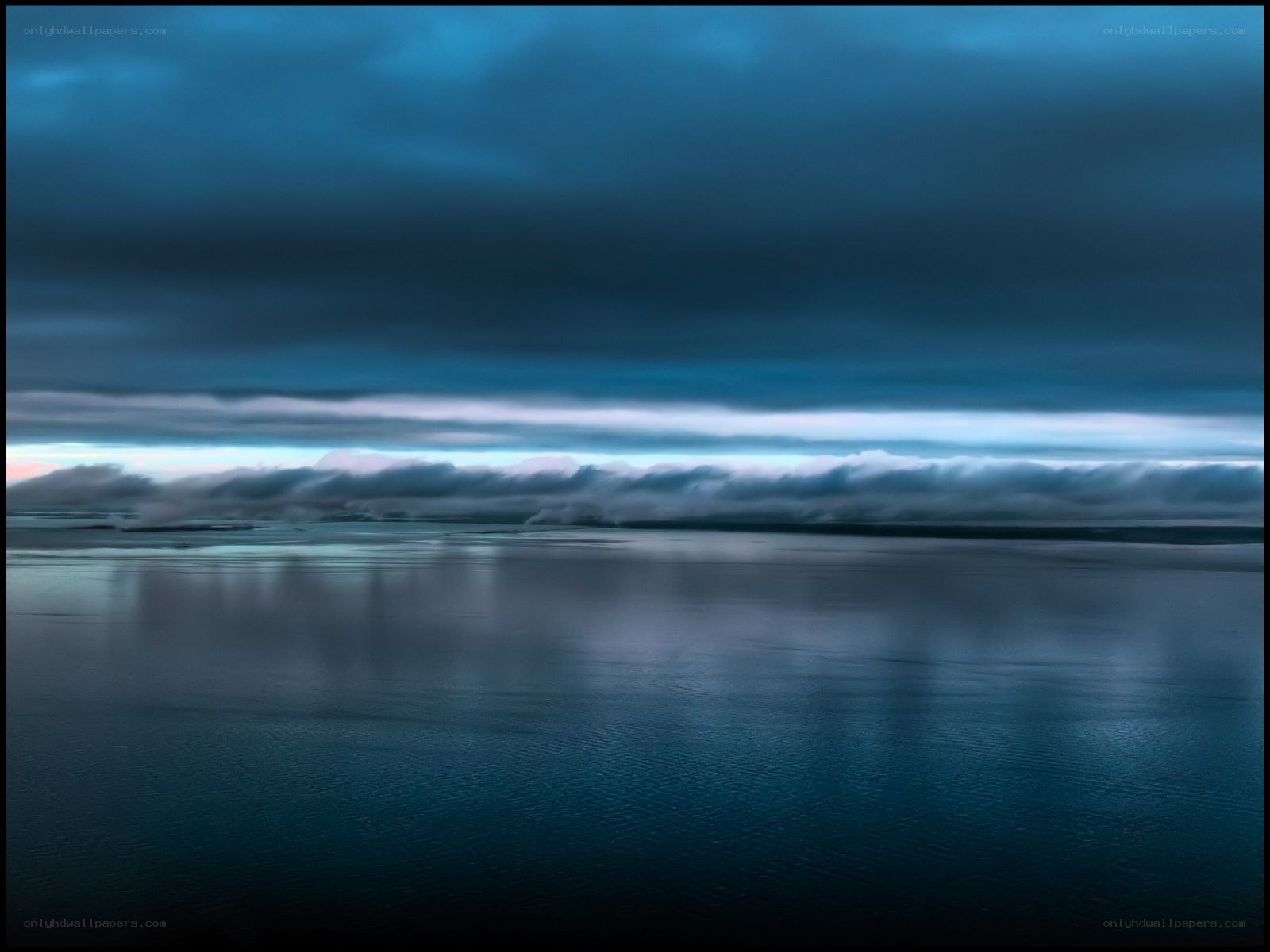 Dark clouds over calm water